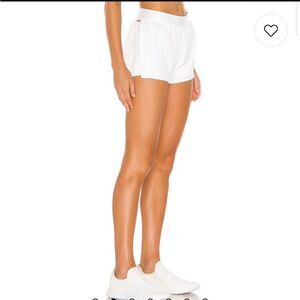 - Alala Court short white pearl sheen large L Revolve